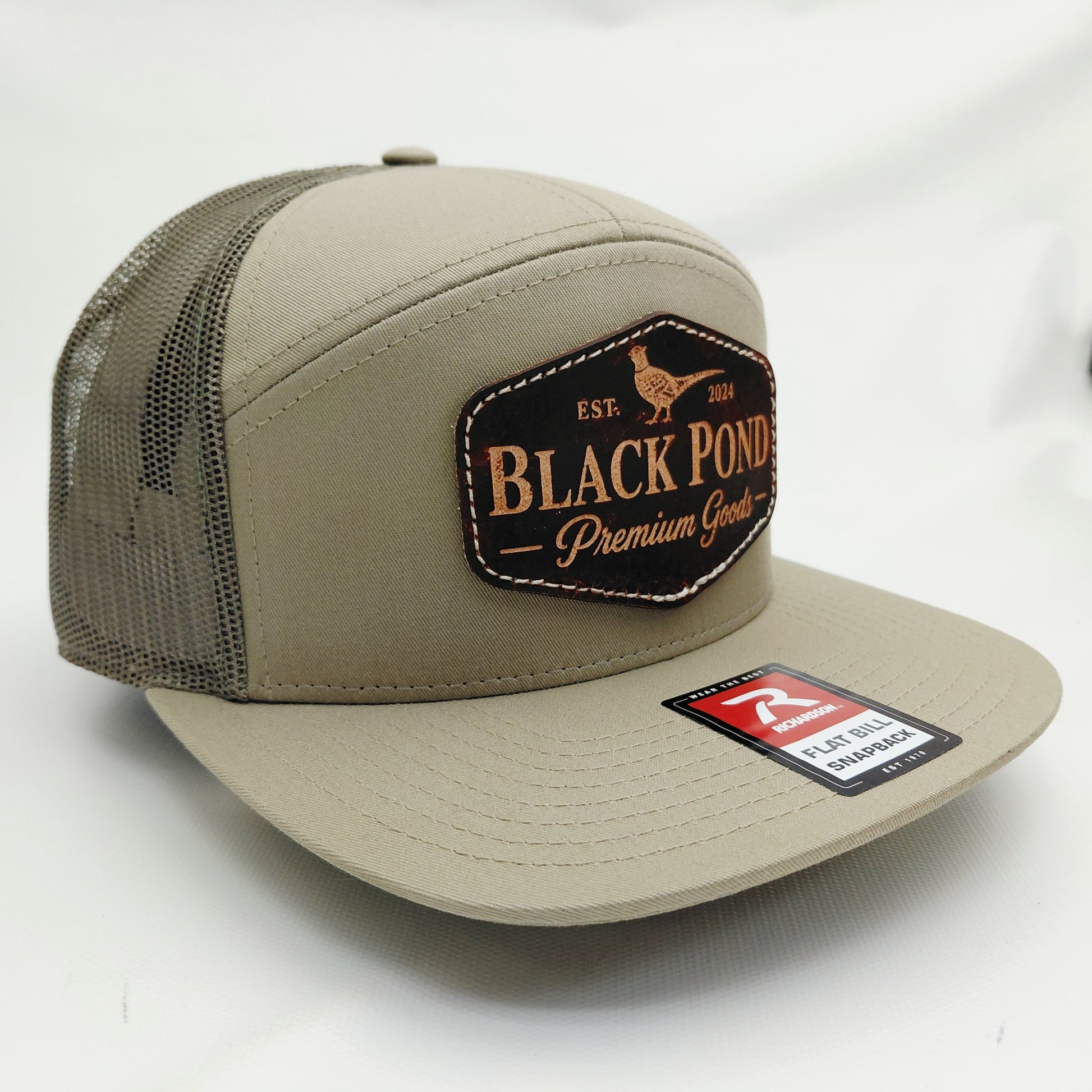 Left angled view of Black Pond pheasant leather patch Richardson snapback hat