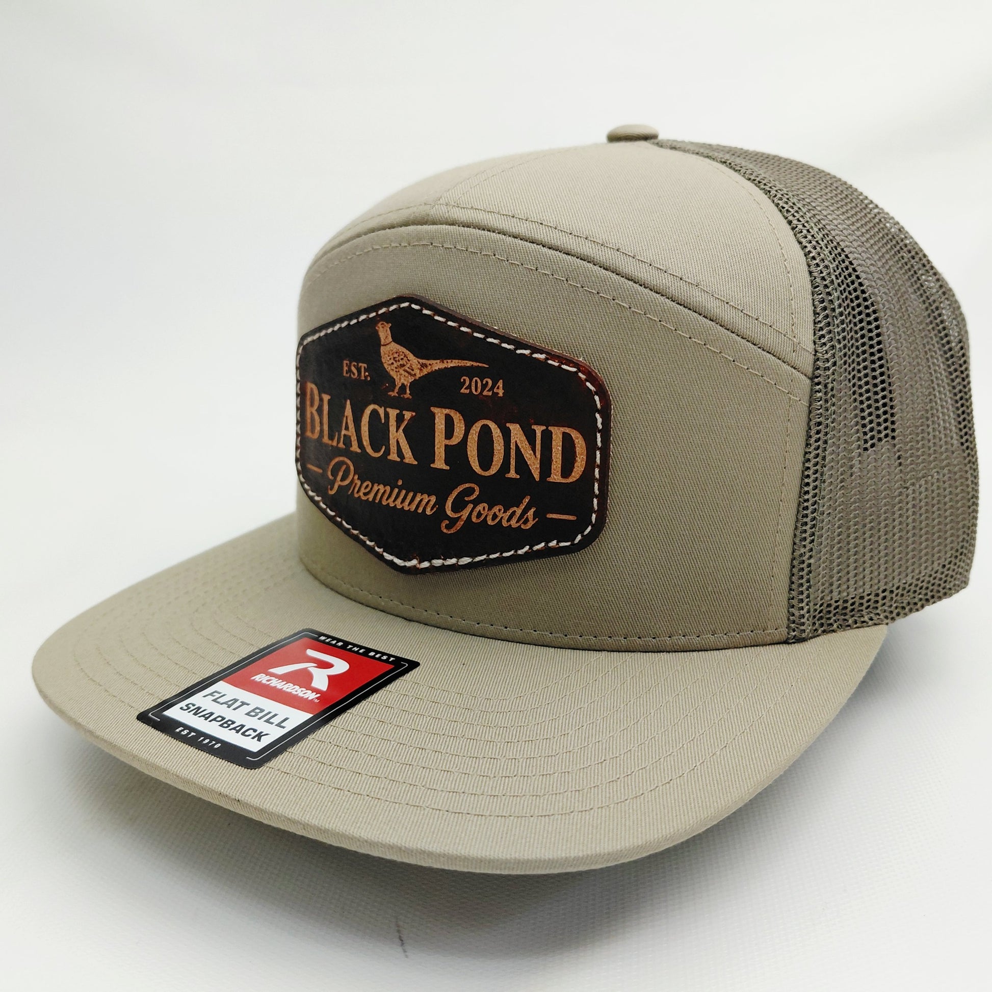 Right angled view of Black Pond pheasant leather patch Richardson snapback hat