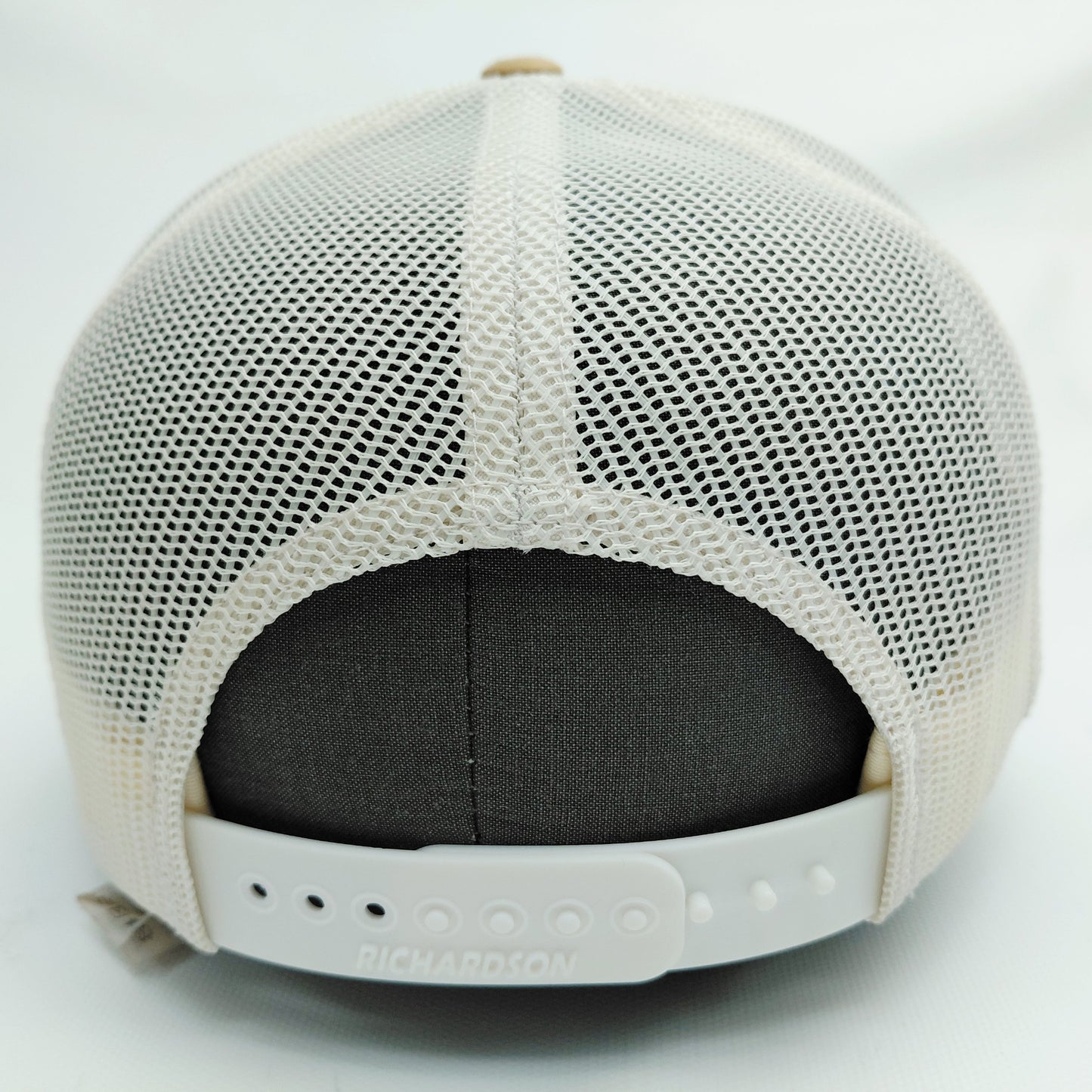 White mesh back and adjustable snap closure of Black Pond Richardson 112 hat