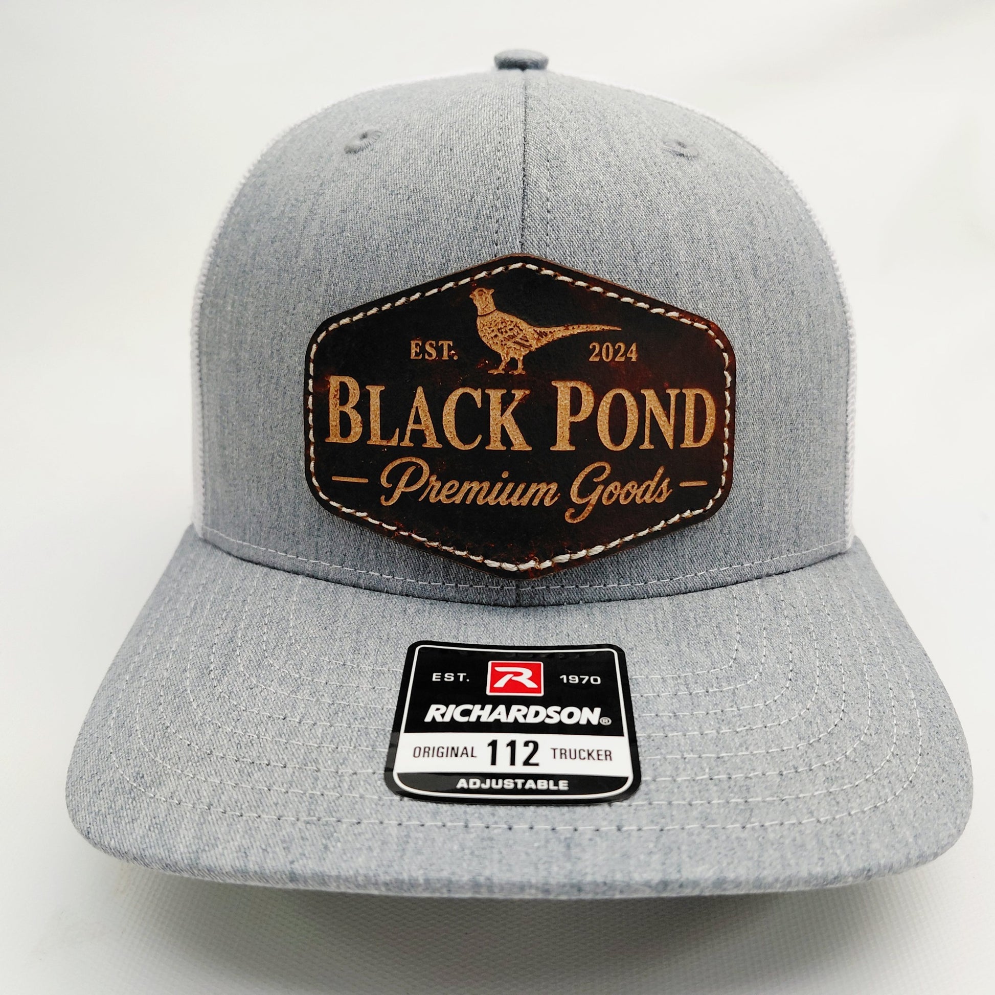 Front view of Black Pond pheasant leather patch Richardson 112 hat in heather gray and white