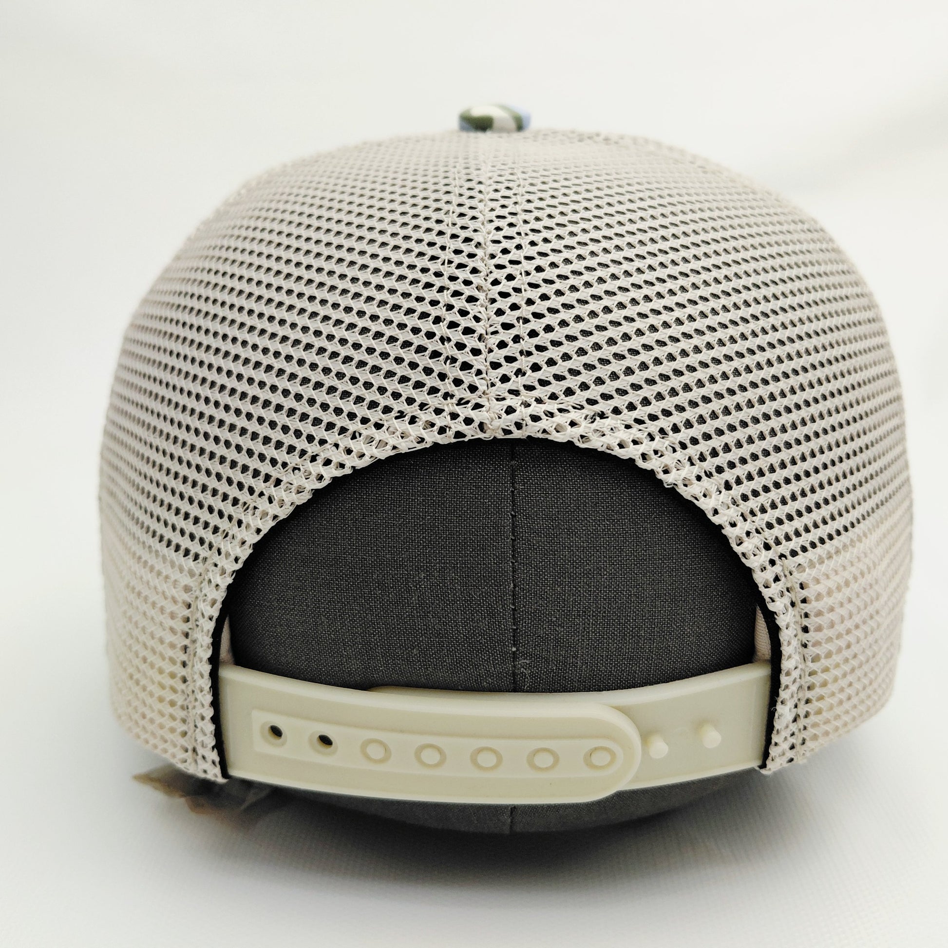 Cream mesh back and adjustable snap closure of Black Pond SOBRO seven-panel hat