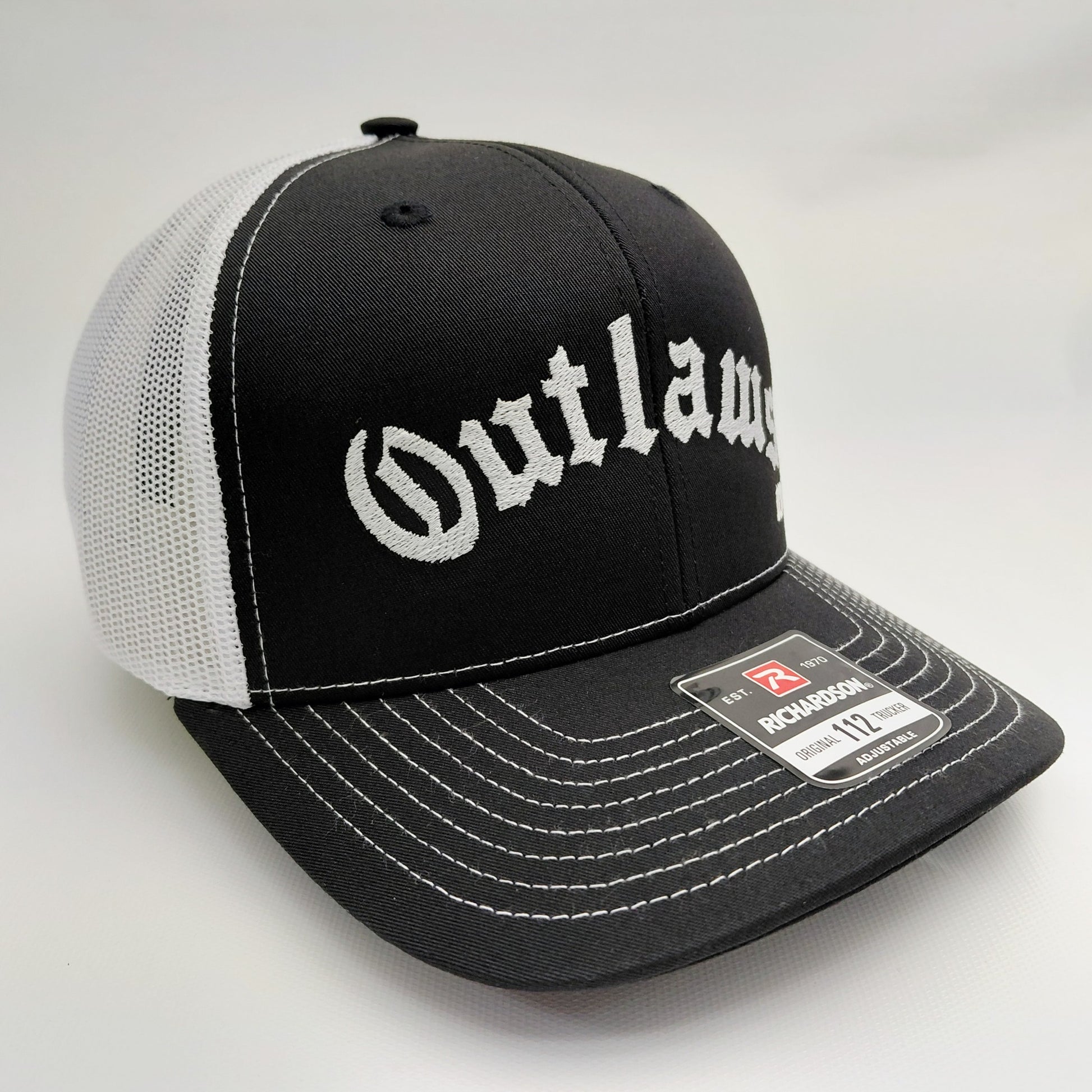 Outlaws MC Richardson 112 embroidered trucker hat angled view