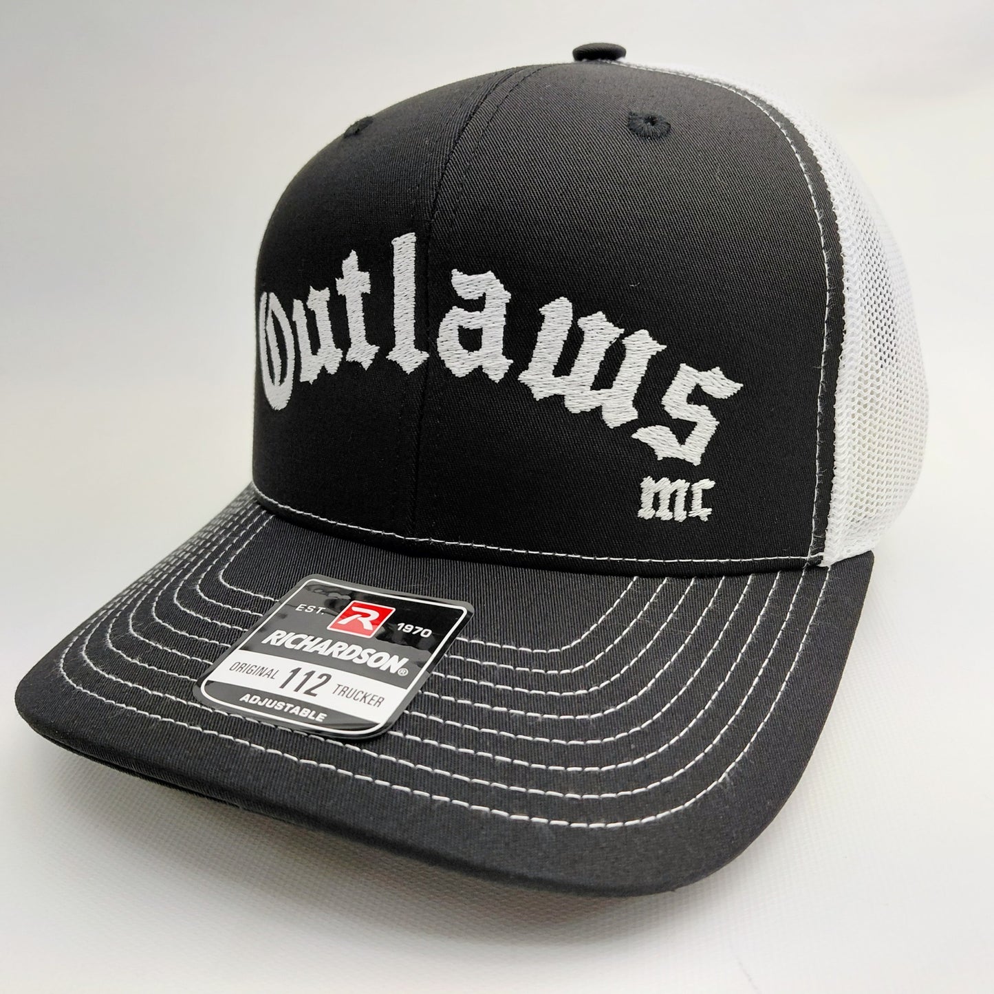 Outlaws MC Richardson 112 black and white trucker hat front view