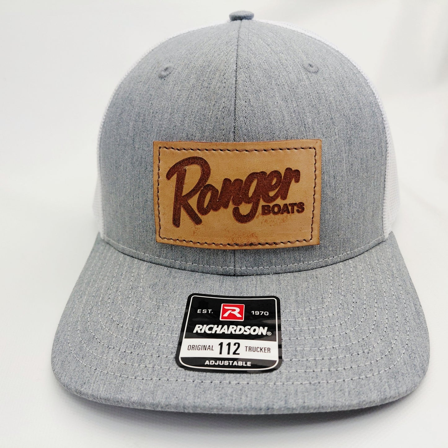 Front view of gray and white Ranger Boats leather patch Richardson 112 trucker hat