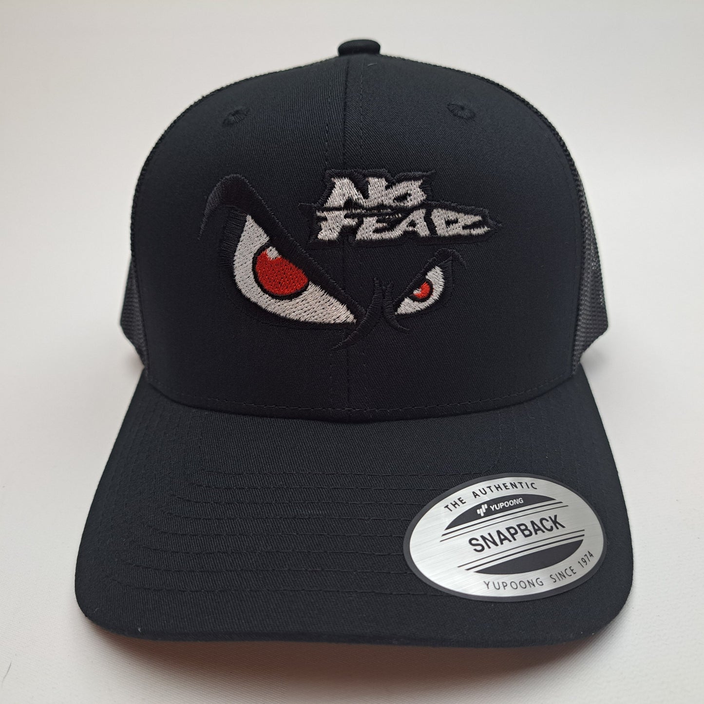 No Fear Angry Eyes Yupoong Curved Bill Mesh Snapback Trucker Baseball Hat Cap Black
